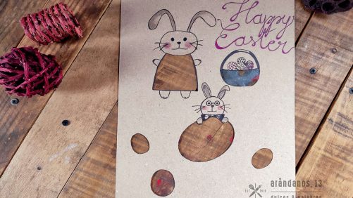 dibujo de conejos de Pascua con huevos y la inscripción Happy Easter